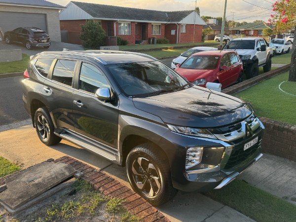 Grey Mitsubishi Pajero Sport parked on a driveway